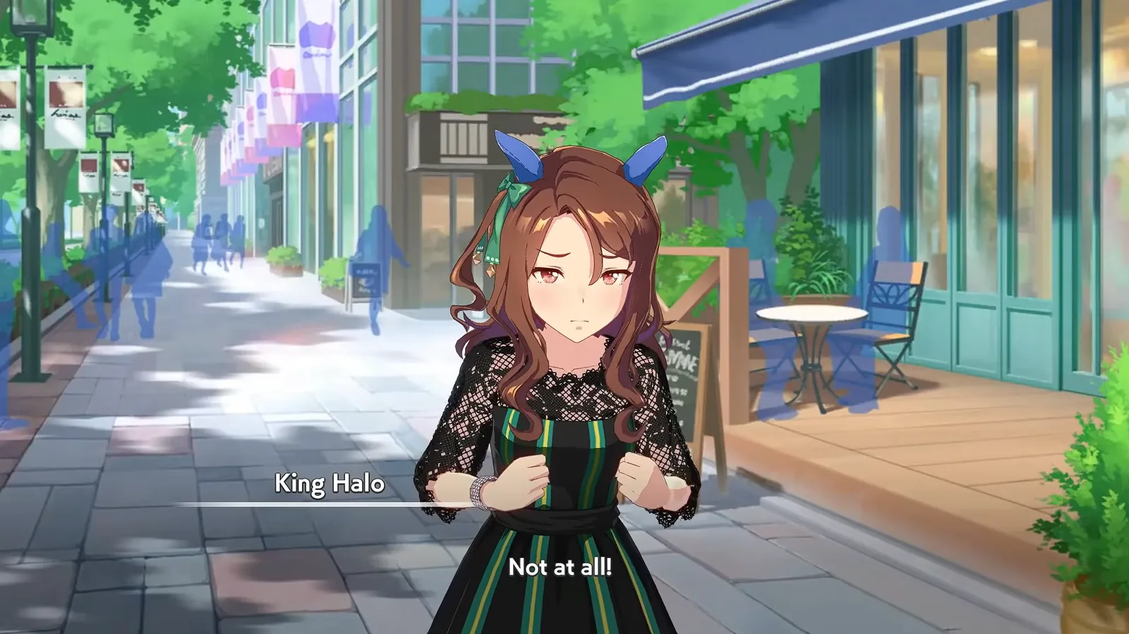 King Halo in a black lace dress on a shopping street, saying Not at all